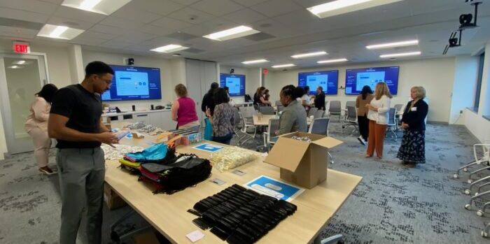 Employees of Parsippany biopharmaceutical company prepare hygiene kits for clients in need
