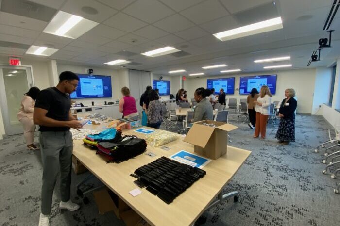 Employees of Parsippany biopharmaceutical company prepare hygiene kits for clients in need